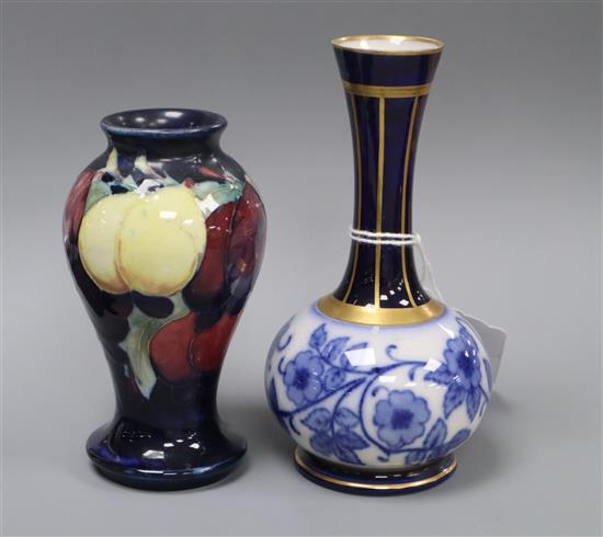 A small Moorcroft wisteria pattern vase and a Macintyre bottle vase